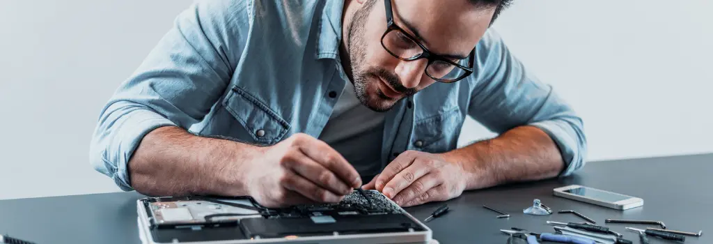 Technician repairing laptop in Melbourne